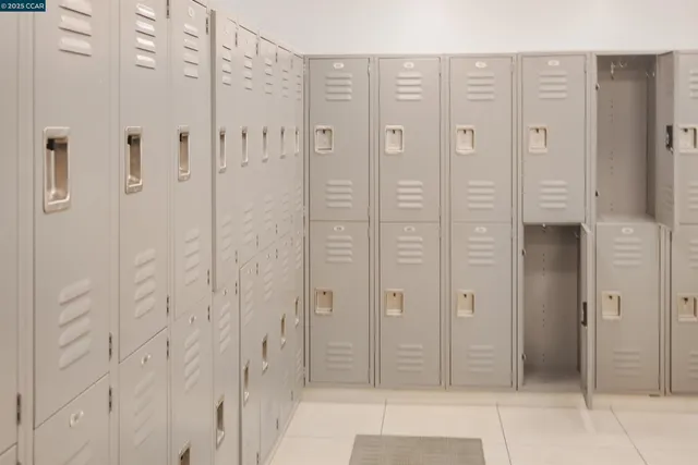 a bathroom with a glass shower door