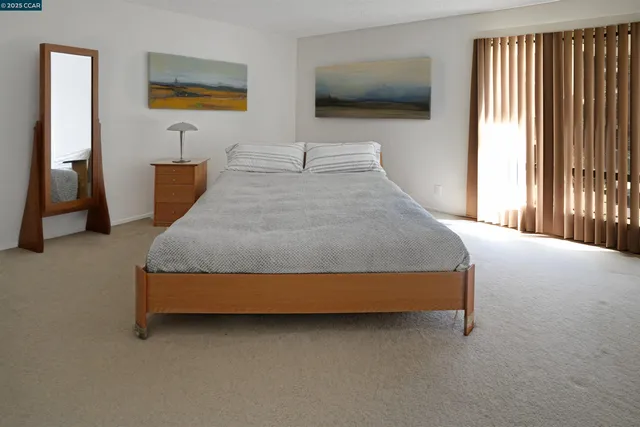 a view of a balcony with a yard