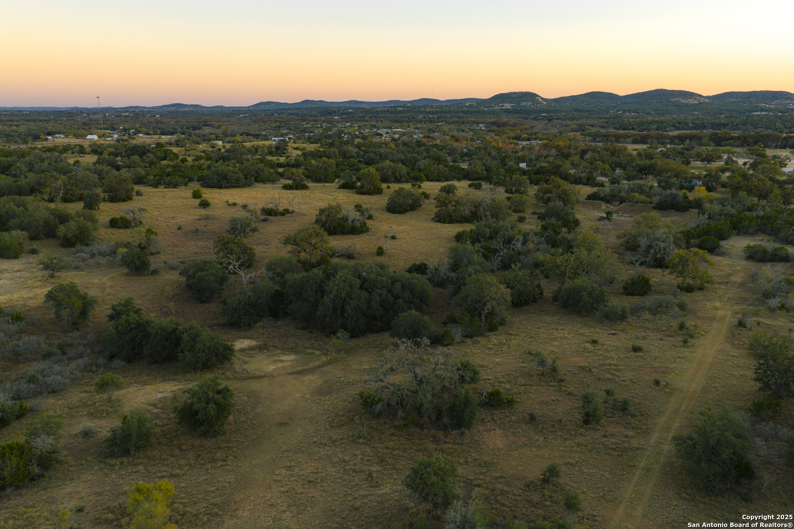 740 Optimist Way Bandera, TX 78003 - Photo 19 of 40 a view of a lot of trees and mountains