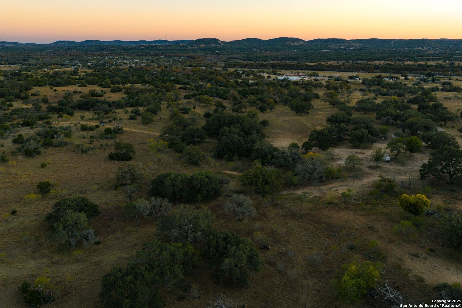 740 Optimist Way Bandera, TX 78003 - Photo 20 of 40 a view of a town with trees in the background