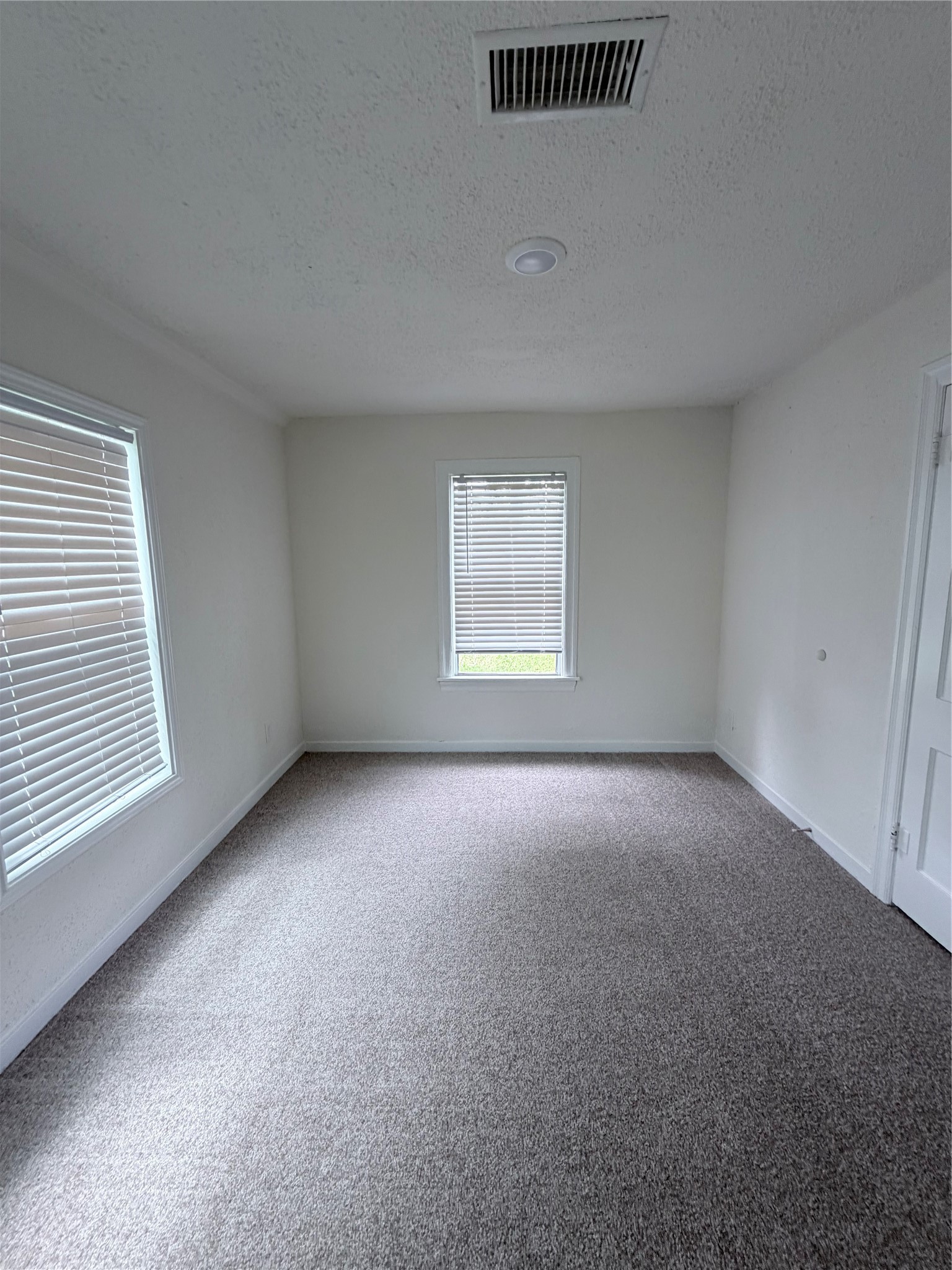1112 3rd Street La Marque, TX 77568 - Photo 13 of 21 an empty room with a window