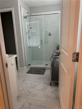 a bedroom with a bed and a table