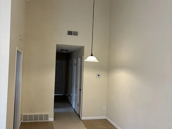 a view of a hallway with closet