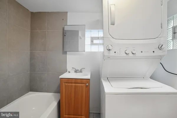 a bathroom with a toilet and a sink