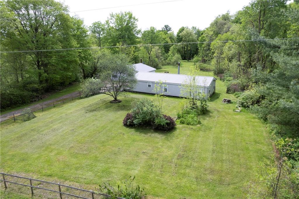 9133 South Watson Run Road Meadville, PA 16335 - Photo 37 of 45 a backyard of a house with lots of green space