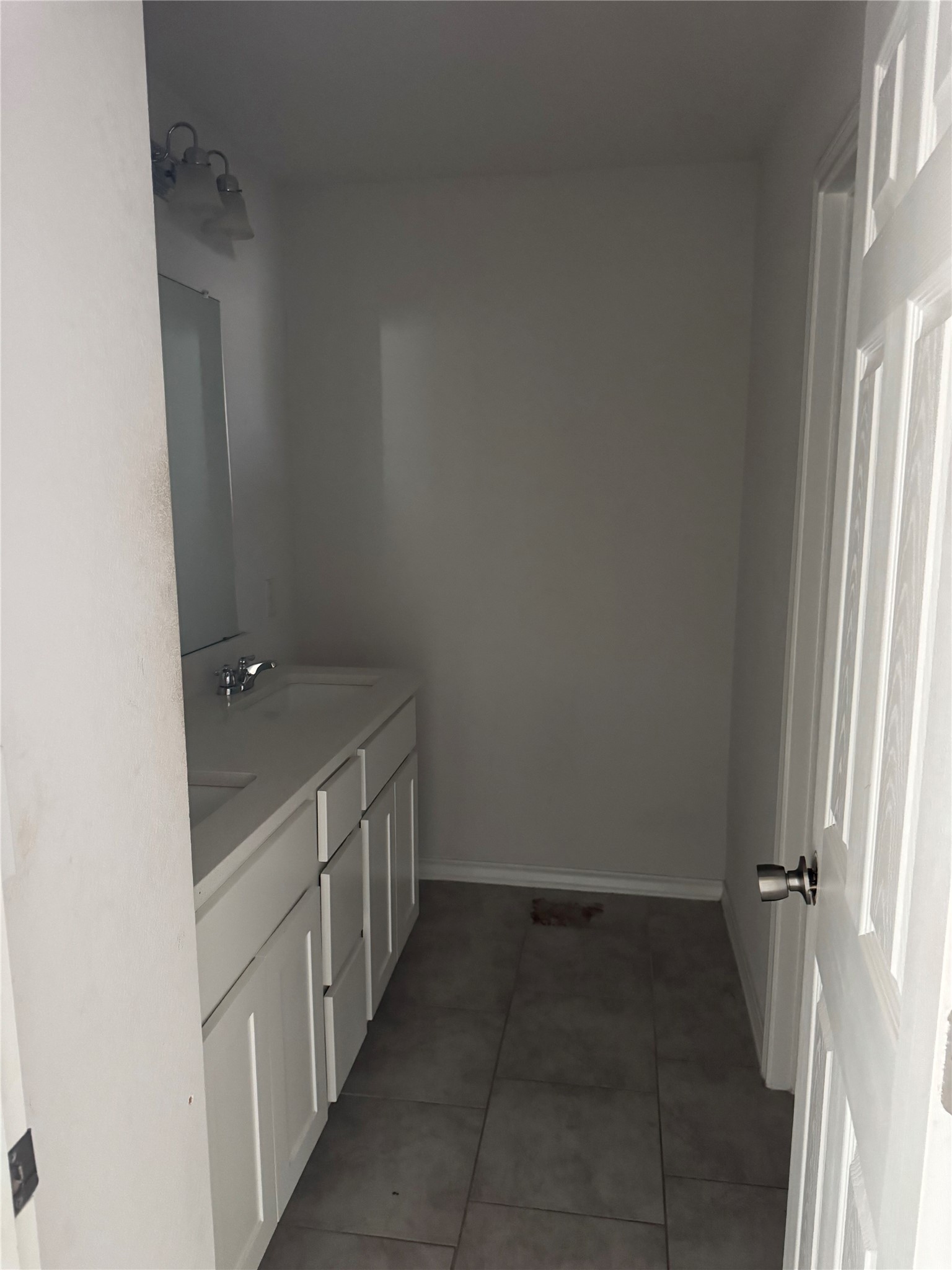 333 Capstone Road Liberty Hill, TX 78642 - Photo 31 of 40 Bathroom with double vanity and light tile patterned flooring