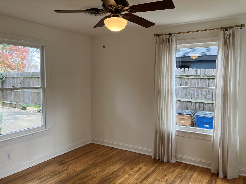 1916 West 39th Street Austin, TX 78731 - Photo 14 of 40 a view of empty room with wooden floor and fan