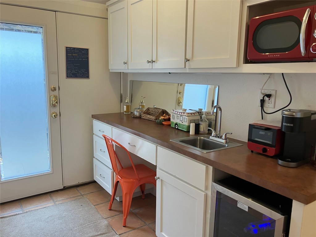 1916 West 39th Street Austin, TX 78731 - Photo 32 of 40 a kitchen with a sink cabinets and appliances