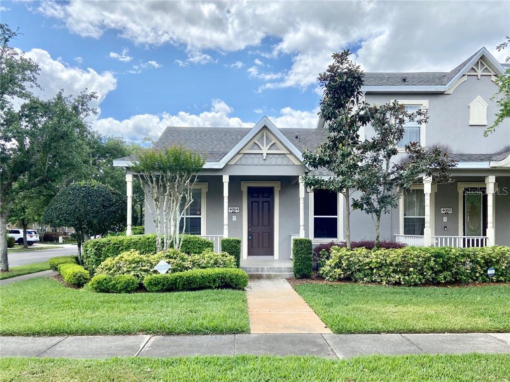 4064 Alcott Circle Orlando, FL 32828 - Photo 1 of 1 a front view of a house with a garden