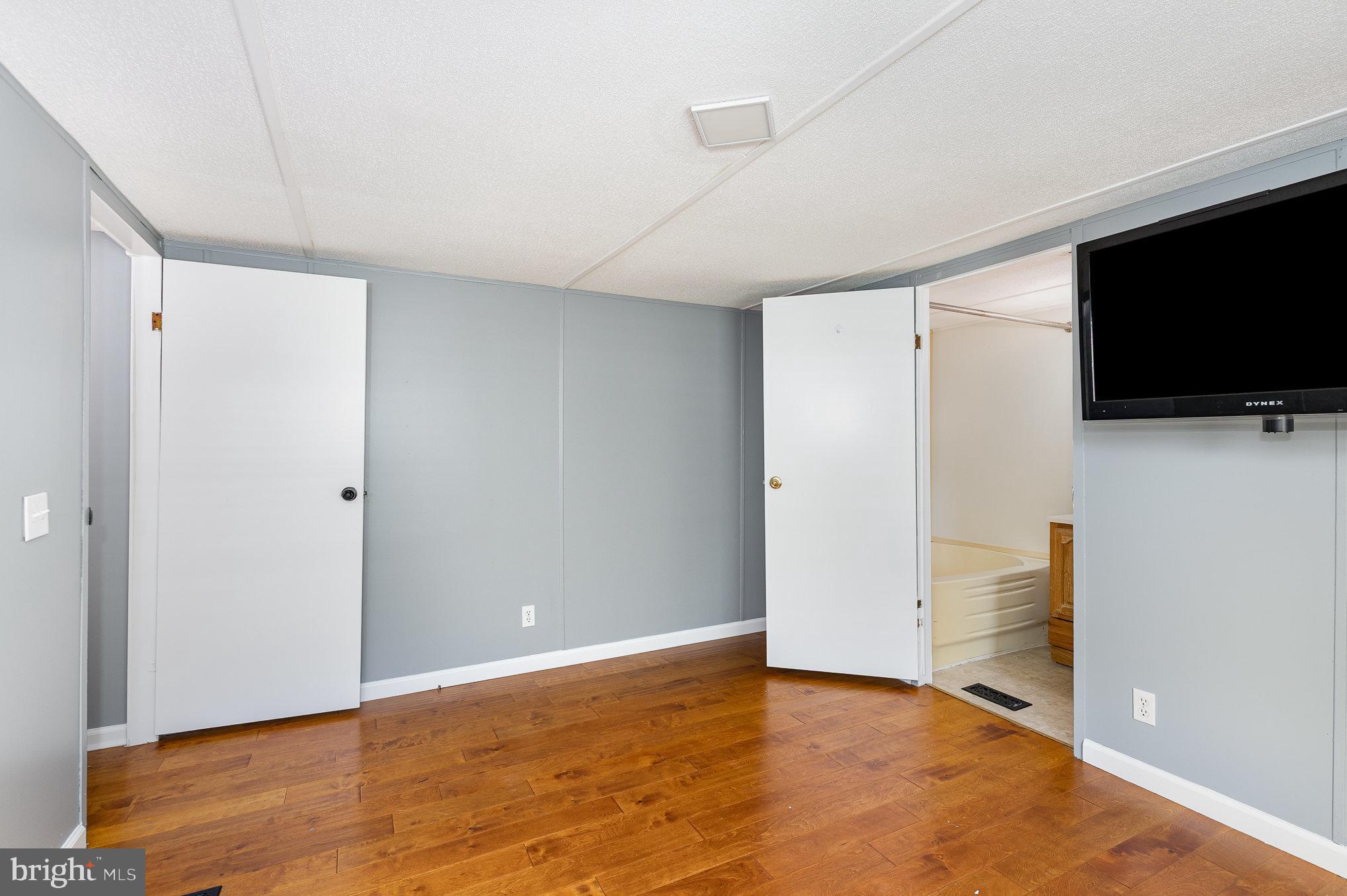 29 Renee Road Stafford, VA 22556 - Photo 16 of 24 a view of an empty room with wooden floor and a window