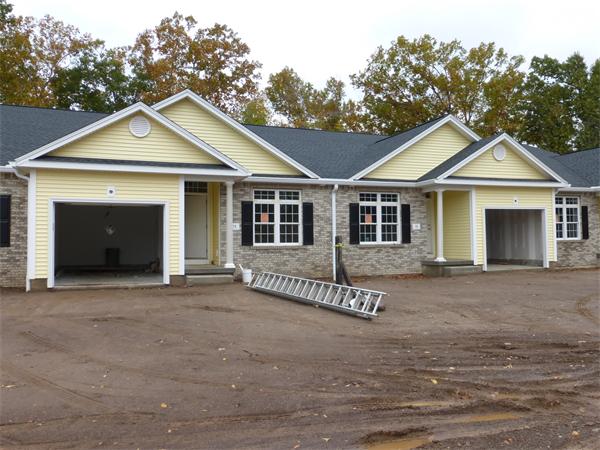 73 Beech Hill Road, Unit 39 West Springfield, MA 01089 - Photo 1 of 1 a front view of a house with a garden and yard