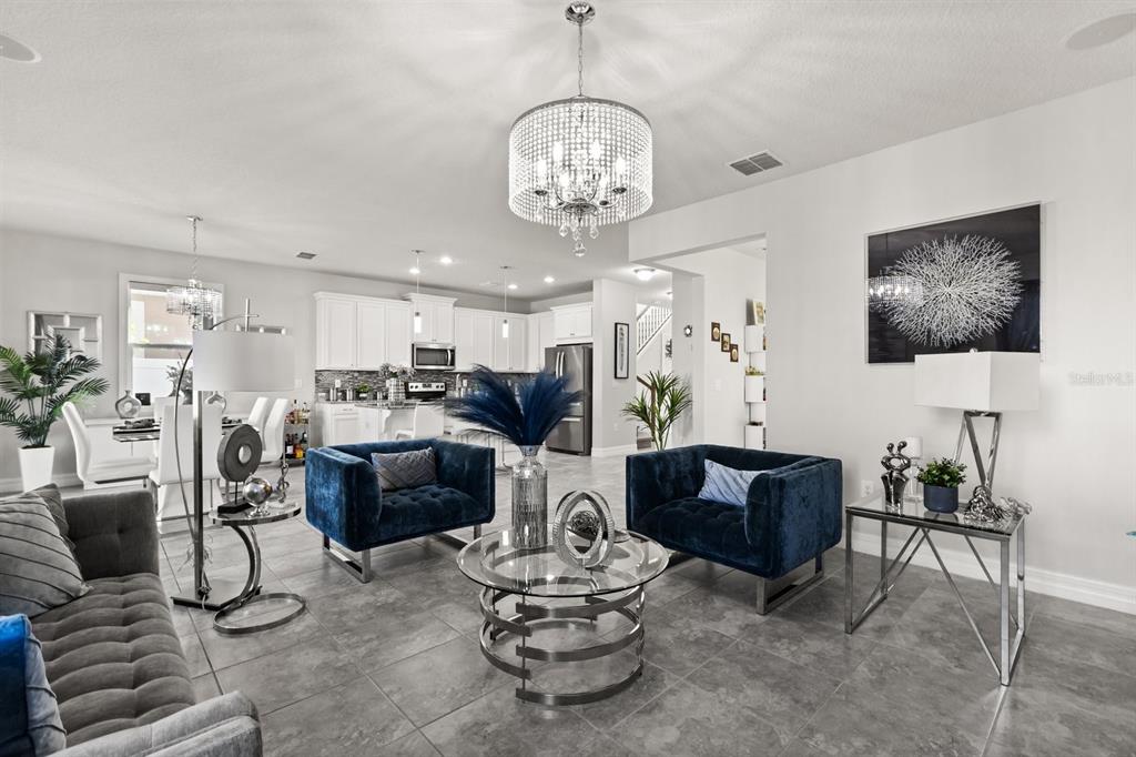 2417 Chateau Loop Kissimmee, FL 34741 - Photo 2 of 16 a living room with furniture and kitchen view