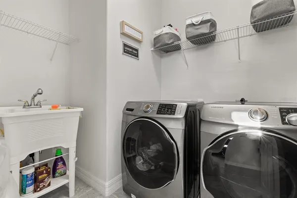 a utility room with dryer and washer