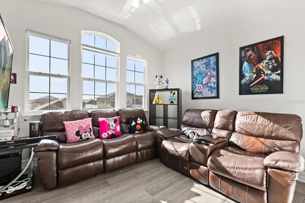 a living room with furniture and a window