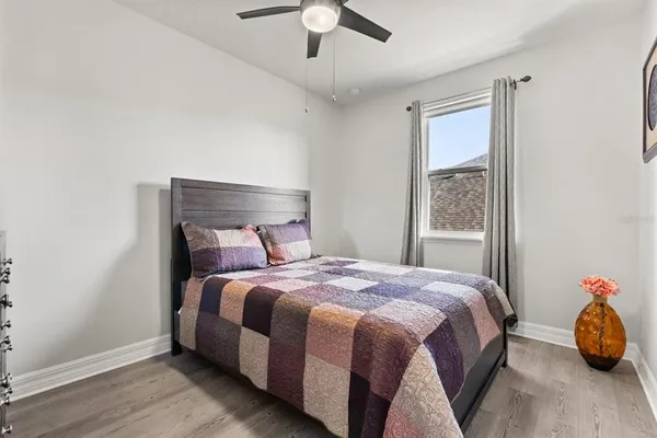 a bedroom with a bed and a window