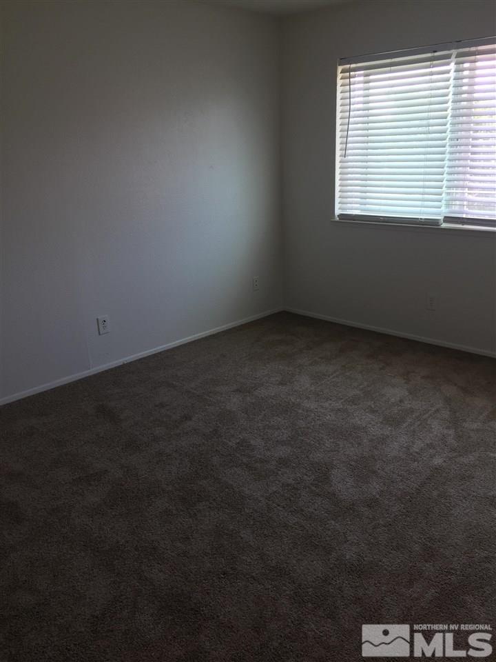 10030 Humite Lane Reno, NV 89506 - Photo 10 of 12 an empty room with a window