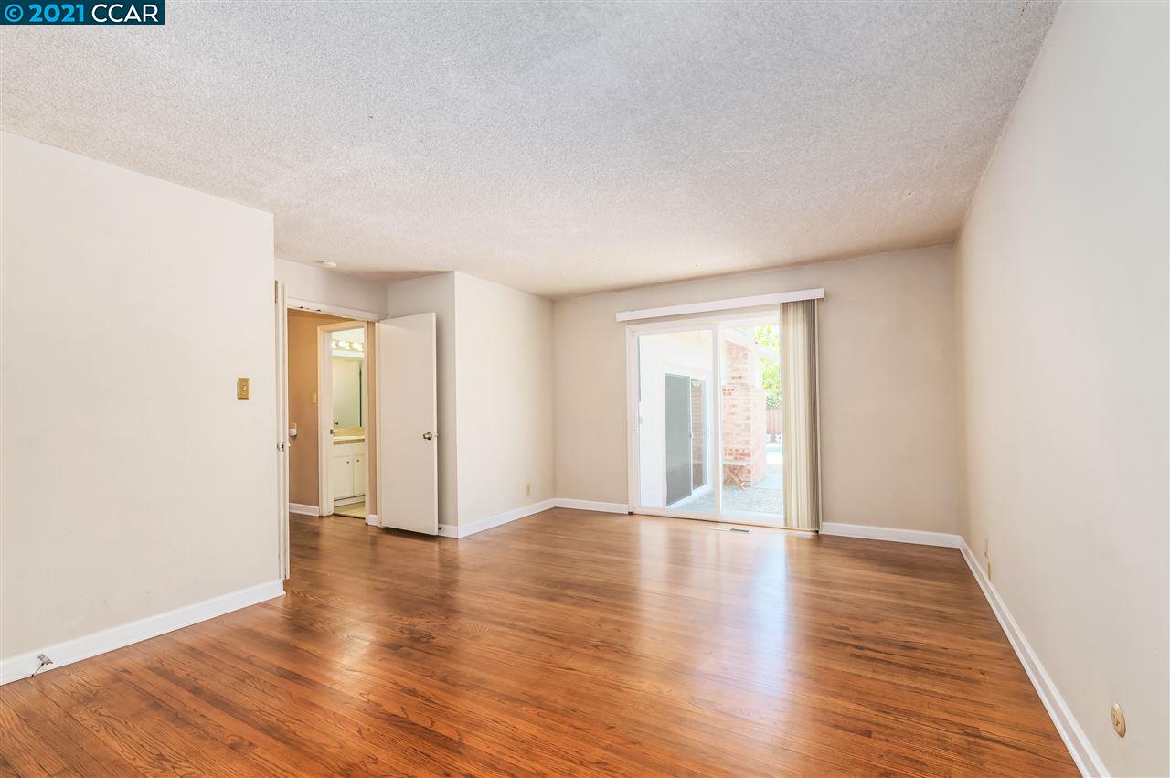 348 Barrett Circle Danville, CA 94526 - Photo 14 of 23 a view of an empty room with window and wooden floor