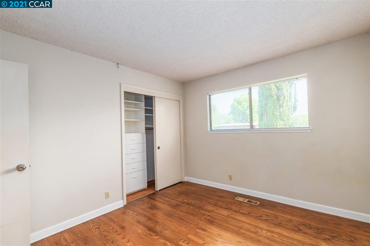 348 Barrett Circle Danville, CA 94526 - Photo 16 of 23 a view of an empty room with wooden floor and a window