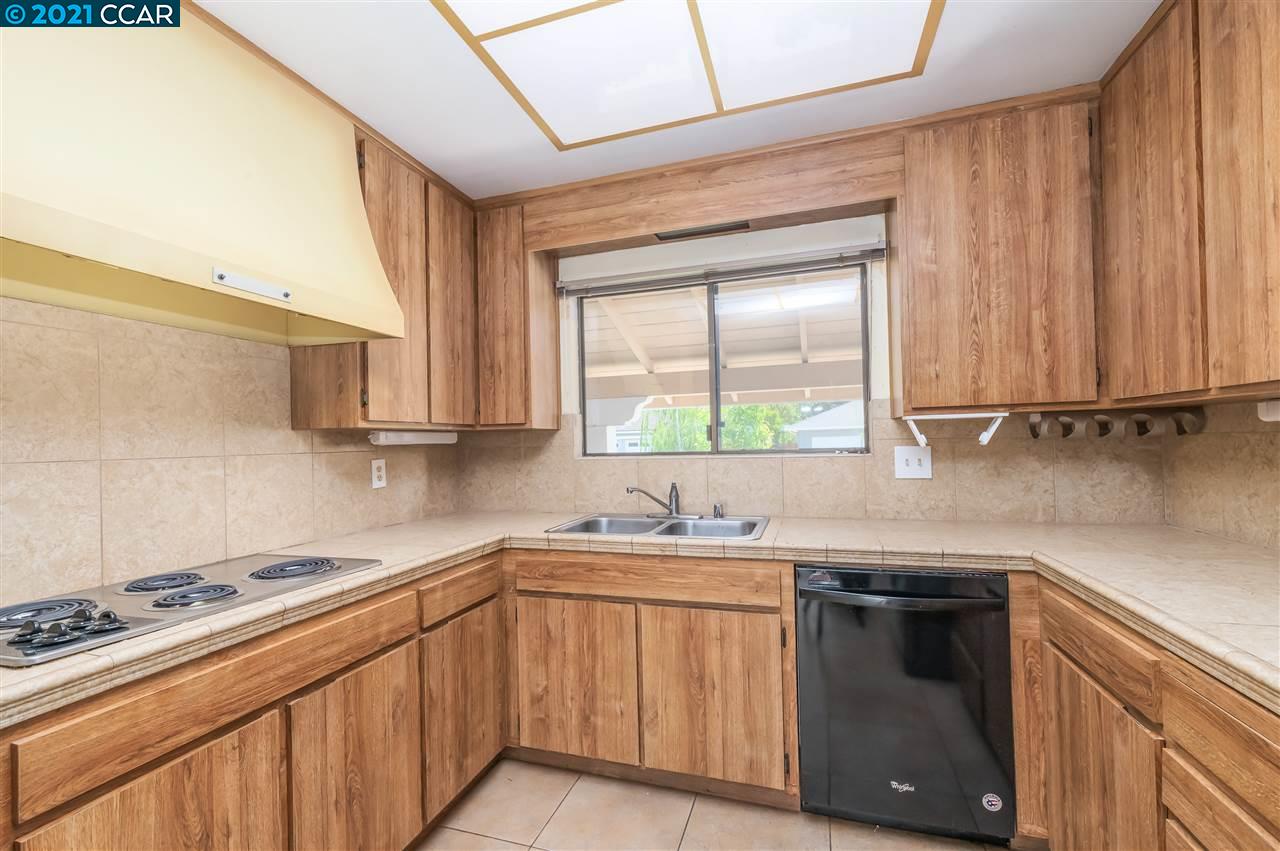 348 Barrett Circle Danville, CA 94526 - Photo 8 of 23 a kitchen with stainless steel appliances a sink stove and cabinets