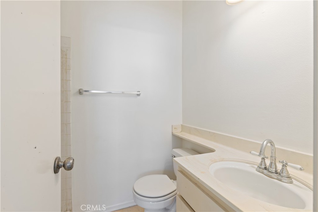 9502 Vía Salerno Burbank, CA 91504 - Photo 12 of 18 a white toilet sitting next to a bathroom sink