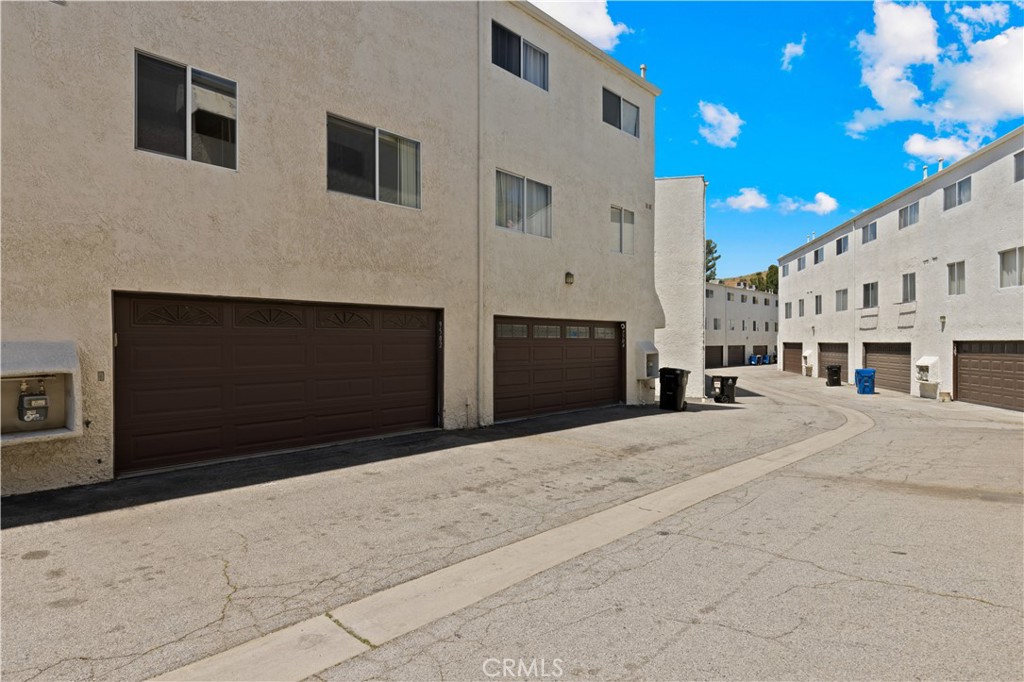 9502 Vía Salerno Burbank, CA 91504 - Photo 15 of 18 a living room with a fireplace and a ceiling fan