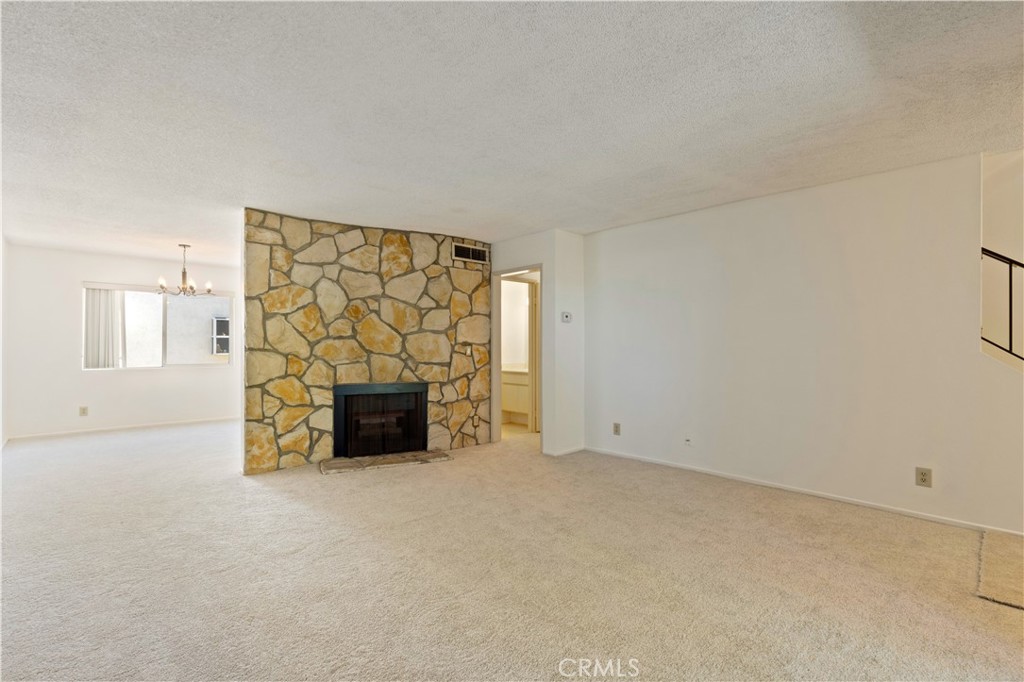 9502 Vía Salerno Burbank, CA 91504 - Photo 3 of 18 a view of an empty room with a fireplace