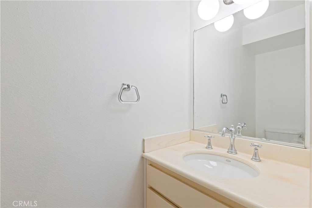 9502 Vía Salerno Burbank, CA 91504 - Photo 7 of 18 a bathroom with a sink and a mirror