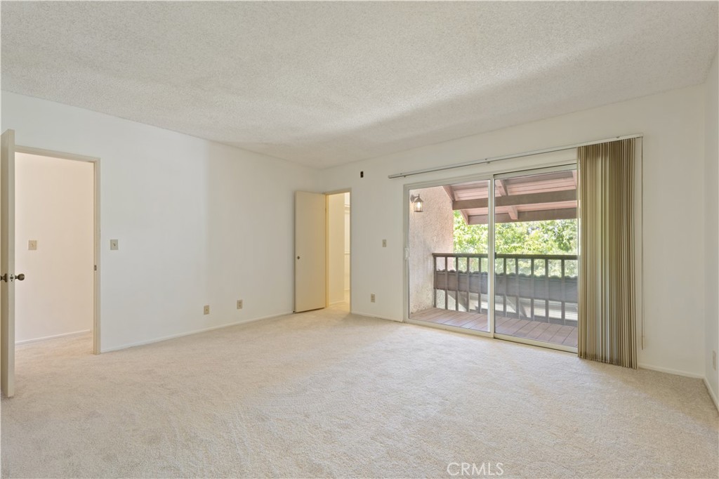 9502 Vía Salerno Burbank, CA 91504 - Photo 8 of 18 a view of an empty room with a sliding door