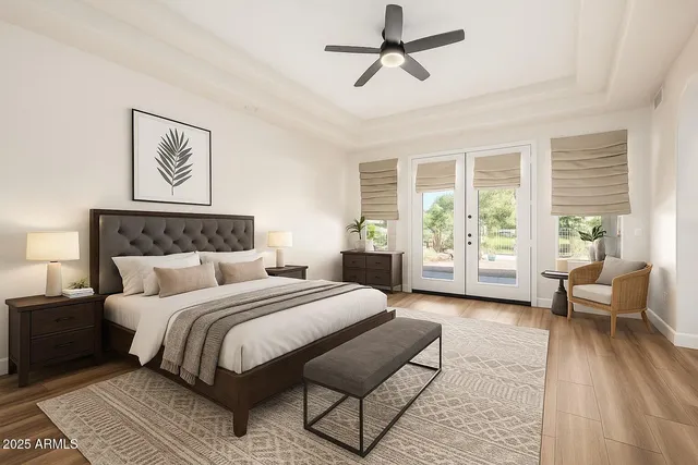 a bedroom with a large bed couch and a window