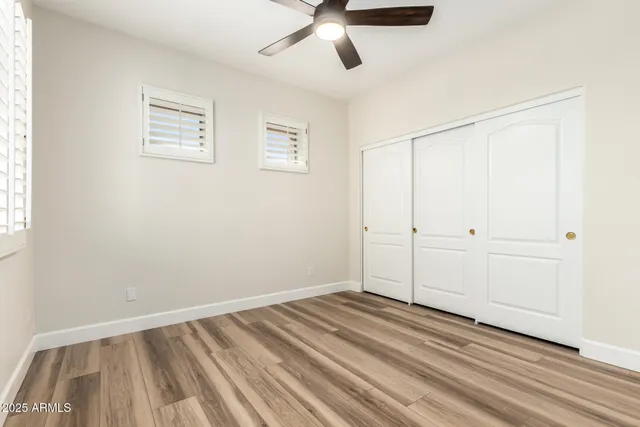 a view of a room with wooden floor
