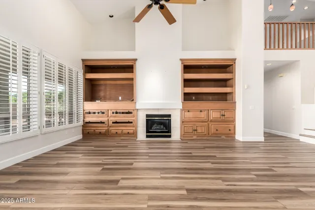 a view of a livingroom with a dishwasher and a fireplace