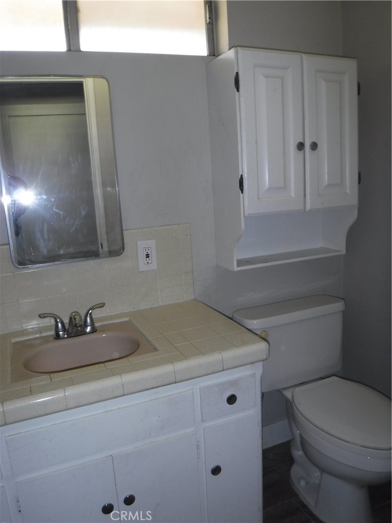706 West Carroll Avenue Glendora, CA 91741 - Photo 15 of 24 a bathroom with a sink toilet and mirror