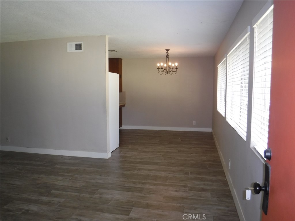 706 West Carroll Avenue Glendora, CA 91741 - Photo 6 of 24 a view of empty room with wooden floor and fan