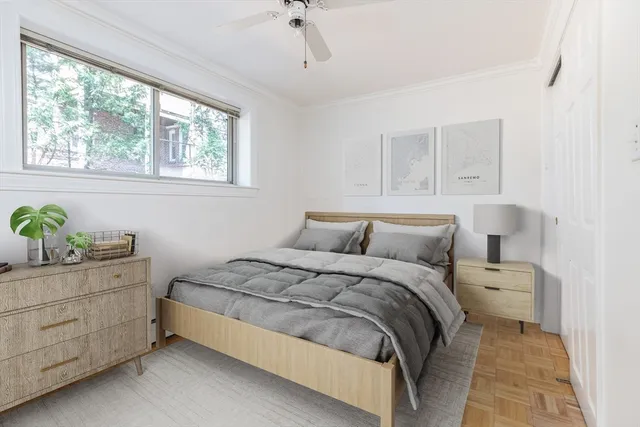 a bedroom with a bed and window