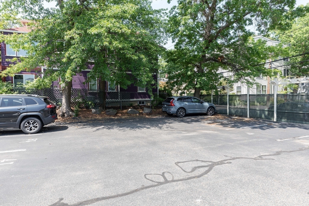 329 Harvard Street, Unit 1 Cambridge, MA 02139 - Photo 8 of 8 a car parked in front of a house