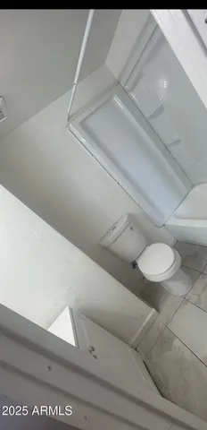 a bathroom with a toilet and a vanity