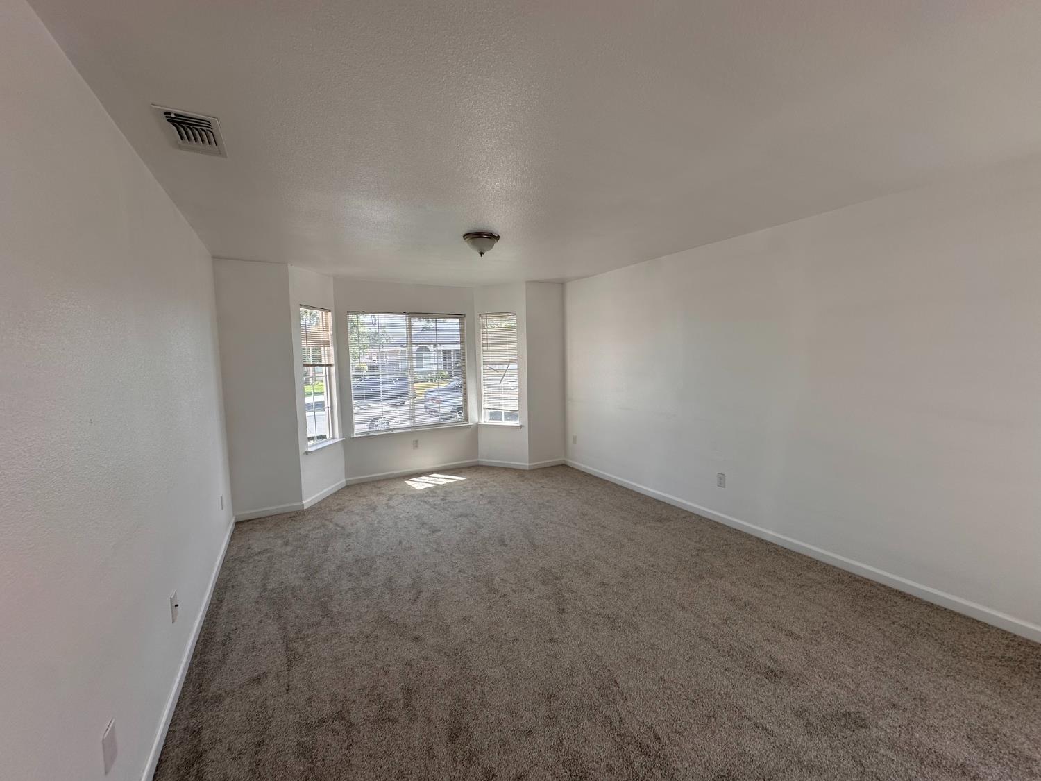 911 Toro Lane Lathrop, CA 95330 - Photo 16 of 36 Spacious living room with bay window.