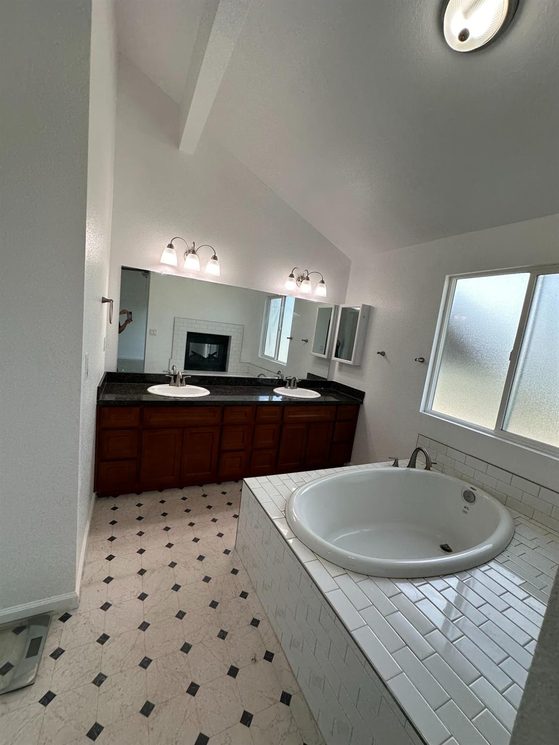 911 Toro Lane Lathrop, CA 95330 - Photo 10 of 36 Primary Bathroom with granite counter, double sinks and soaking tub,