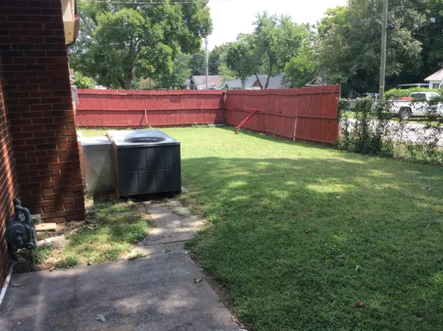 a backyard of a house with lots of green space