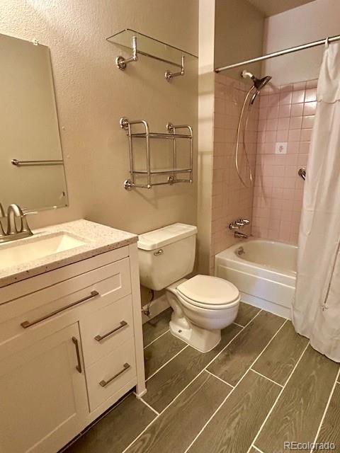 1009 Acadia Avenue Lafayette, CO 80026 - Photo 14 of 46 a bathroom with a granite countertop toilet sink and shower