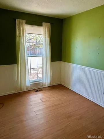 a view of a hallway with furniture