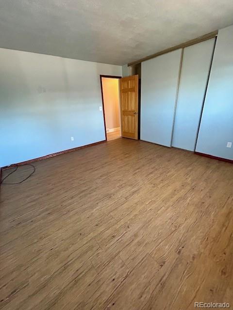 1009 Acadia Avenue Lafayette, CO 80026 - Photo 22 of 46 a view of empty room with wooden floor