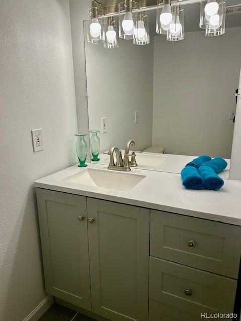 1009 Acadia Avenue Lafayette, CO 80026 - Photo 35 of 46 a bathroom with a sink and a mirror