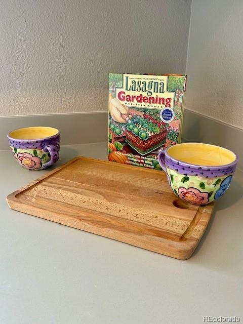 1009 Acadia Avenue Lafayette, CO 80026 - Photo 10 of 46 a room with a table and a mirror