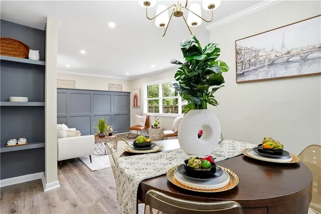 a living room with furniture flowerpot and a potted plant