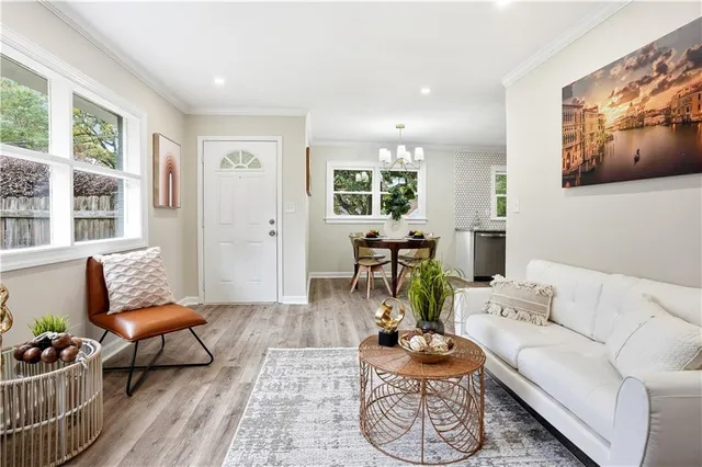 a view of a hallway with a livingroom and a hallway