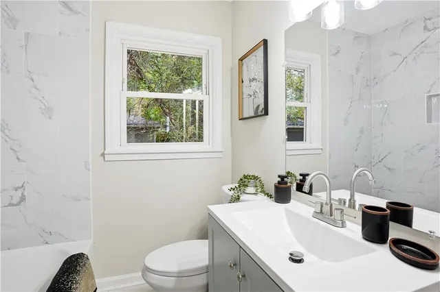 a bathroom with a bathtub and shower
