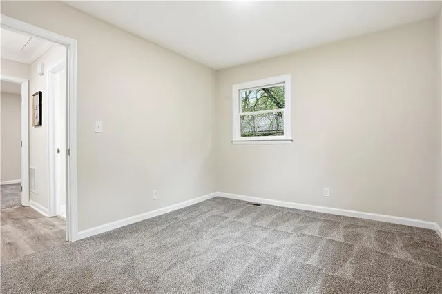 a bedroom with a bed and a fireplace