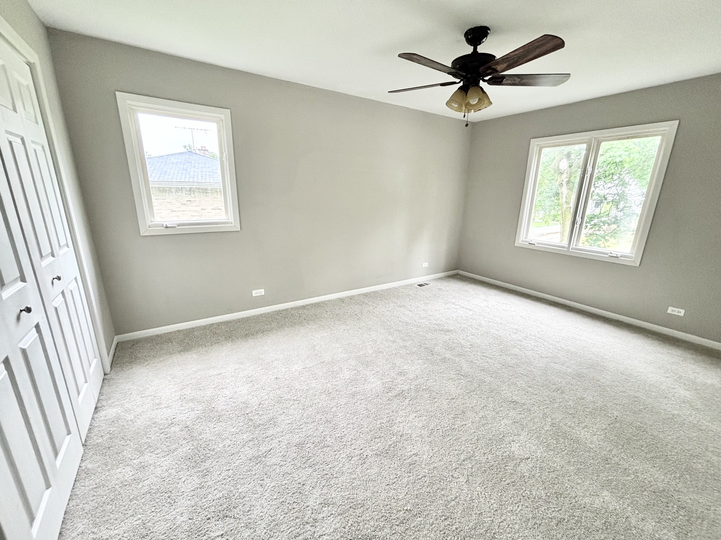615 North Blanchard Street Wheaton, IL 60187 - Photo 11 of 19 an empty room with windows and fan