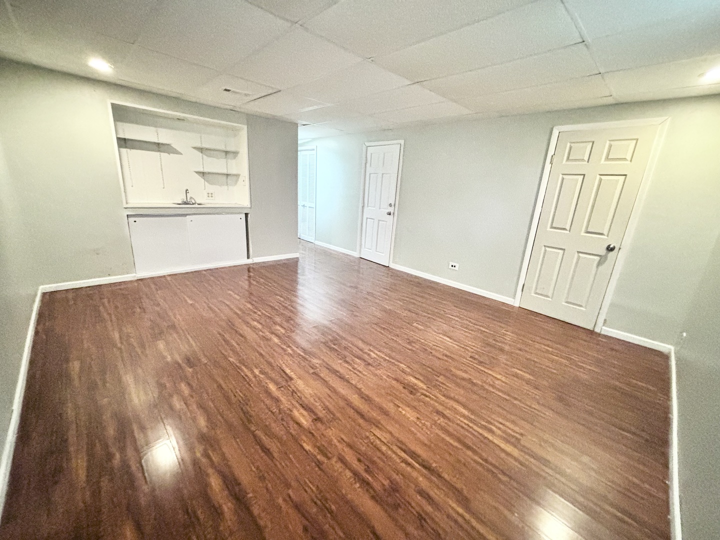 615 North Blanchard Street Wheaton, IL 60187 - Photo 17 of 19 an empty room with wooden floor and windows